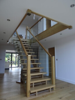 Bespoke Architect designed stairacse in Modern Home from Oak, Glass and aluminium