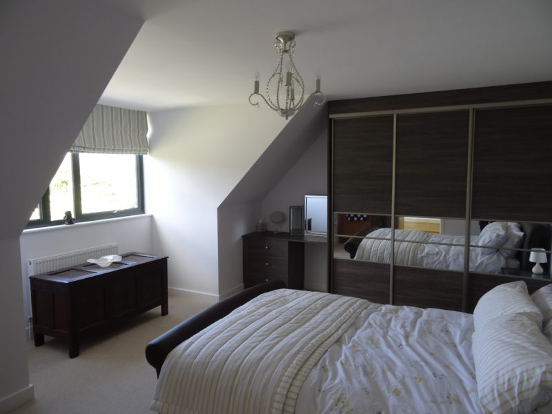 Bedroom with fitted wardrobes in Modern York Home