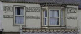 Timber signage to front of 16A Fishergate formerley TM Oxtoby Decorator's Shop